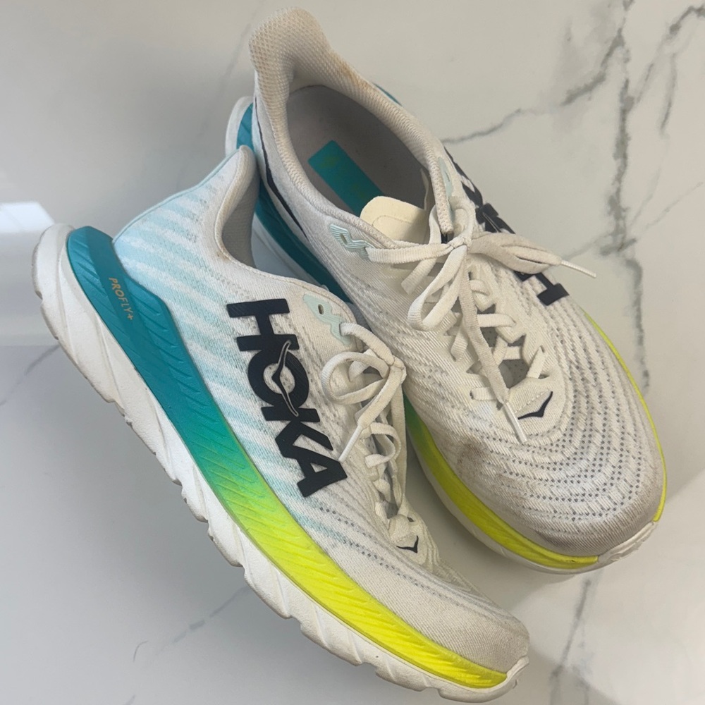 Hoka Cream Running Shoes with Blue and yellow Sole